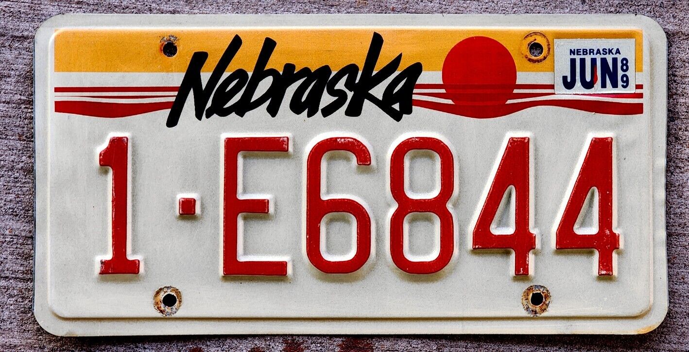 Nebraska "sunrise" License Plate 1 = Douglas County With A 1989 Sticker
